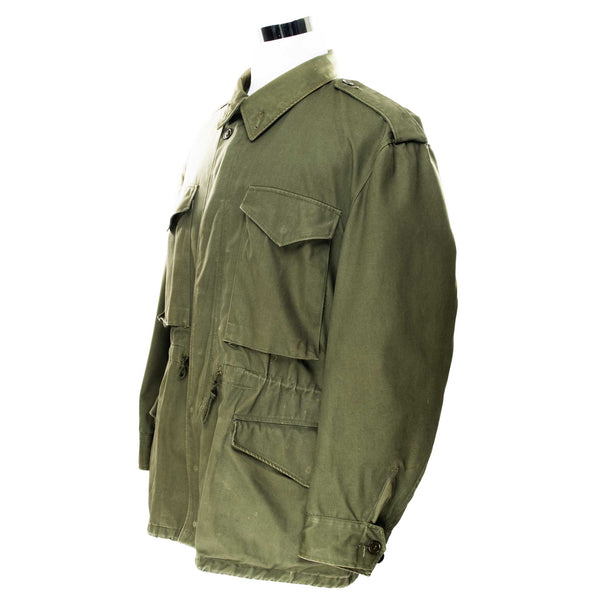 Vintage Us Army M51 Field Jacket 1951 Korean War Size Large Short

Pattern Date: 13 Sept. 1951
Spec. No. Mil-J-11448 (QMC)

The M-51 M1951 field jacket was an US Army four pockets jacket made of 9-ounce wind resistant, water repellent treated cotton sateen cloth in Olive Green Shade 107 (OG 107).